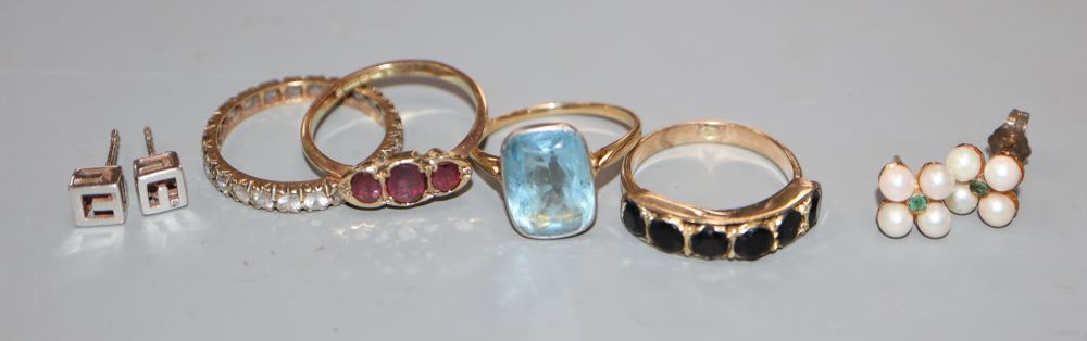 Three 9ct and gem set rings including three stone garnet, a yellow metal and gem set ring and 2 pairs of earstuds
